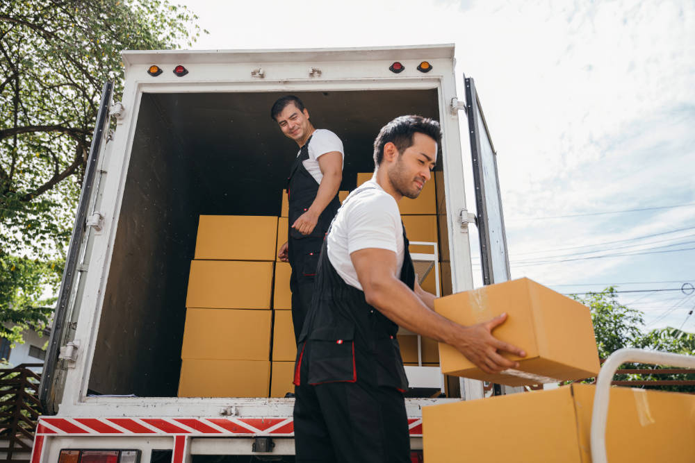 Moving truck with men unloading