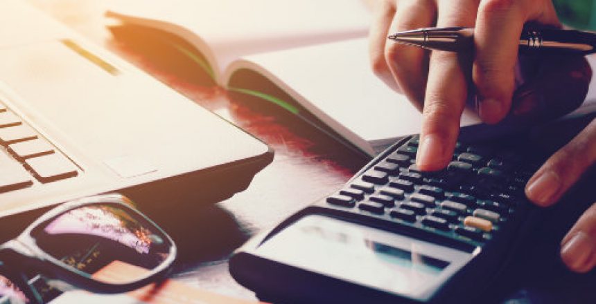 Close Up Woman Doing Finance At Home Office With Calculate Expen