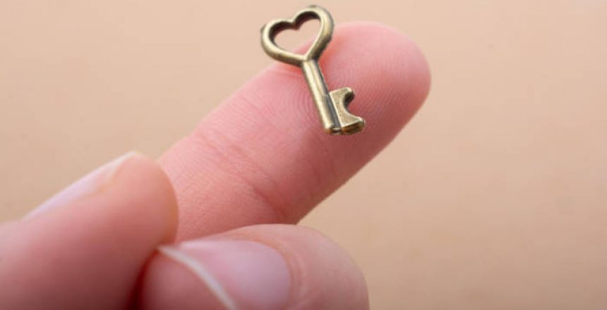 Tiny Key With Heart Shape On The Finger Tip